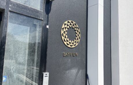 Luxury metallic 3D business signage for Bayview on a dark wall.