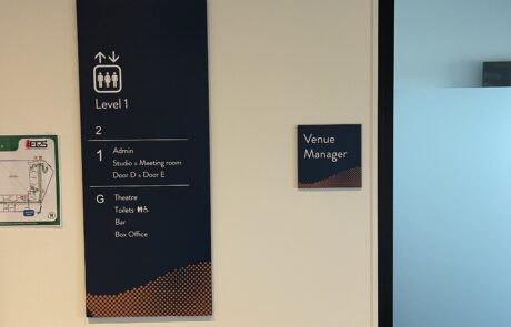 Venue Manager office signage next to a frosted glass door.