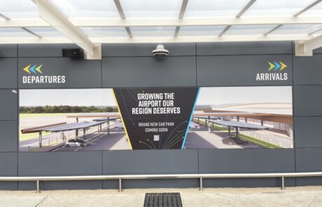 Departures and arrivals signage at an airport terminal