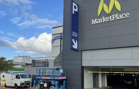 Marketplace shopping centre signage installation installation.