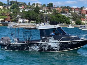 Close-up of detailed custom fish graphics on boat wrap.