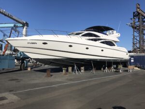Yacht prior to vinyl wrap installation, docked and prepared.