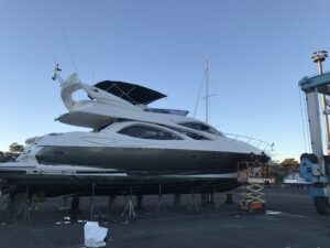 Completed sleek black vinyl wrap on luxury yacht.